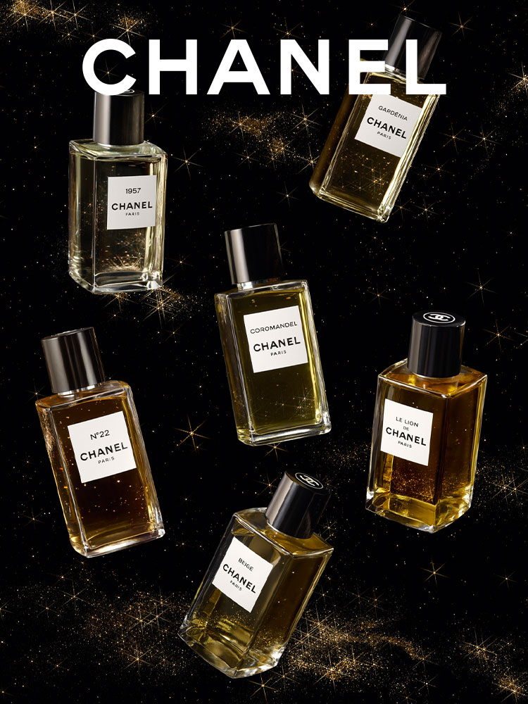 Bottles of LES EXCLUSIFS floating in a starry night sky